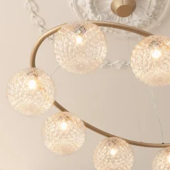 Miira 8 Oval, brass/optic clear